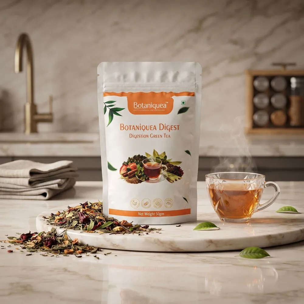botaniquea-digest-digestion-green-tea Botaniquea Digest Digestion Green Tea pouch with a cup of brewed green tea and loose tea leaves